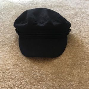 Never worn newsy hat. All black.